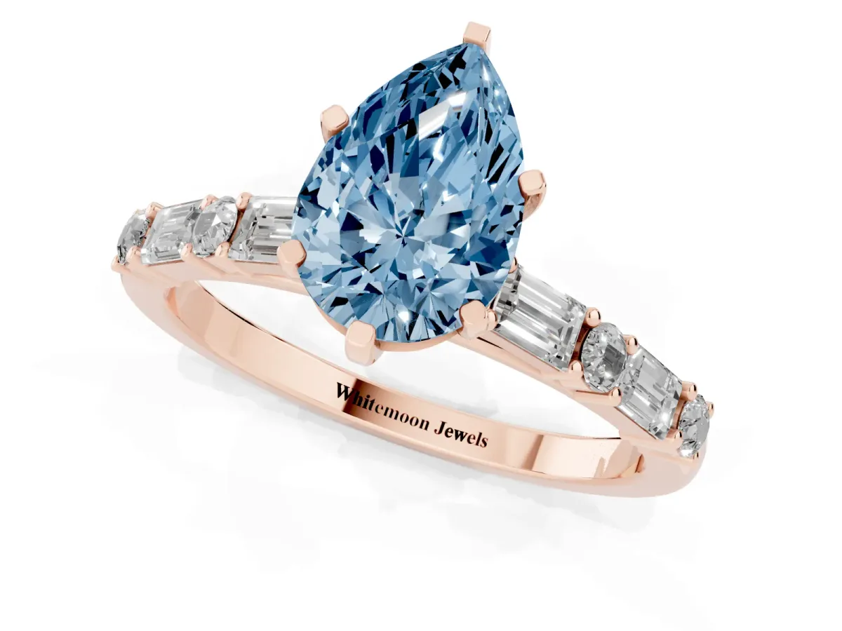 Fancy Blue Pear Cut Diamond Solitaire with Side Baguettes and Channel Set Band Rose gold