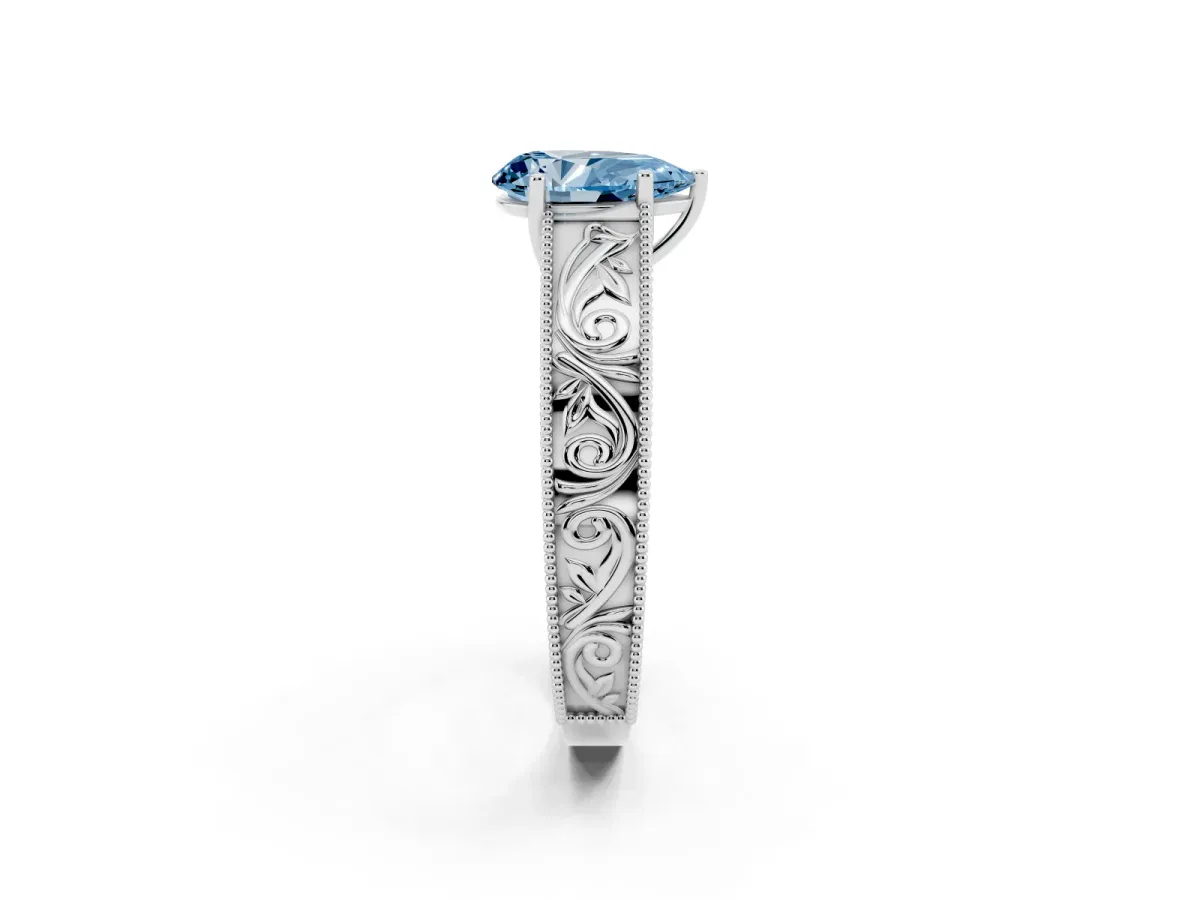 Fancy Blue Pear Cut Diamond Solitaire Ring with Engraved Band and Four-Prong Setting White gold