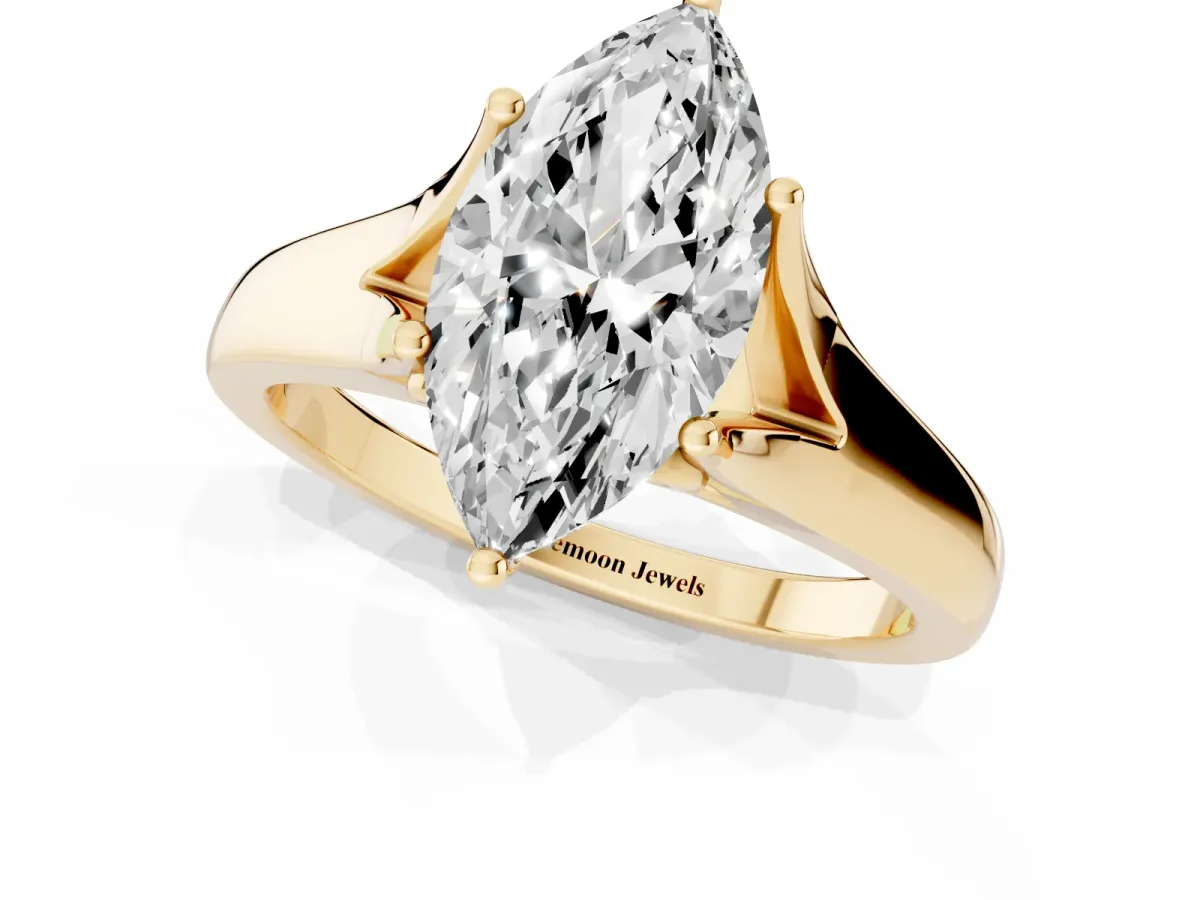 Marquise Cut Solitaire Diamond Ring with Cathedral Band and Four-Prong Setting Yellow gold