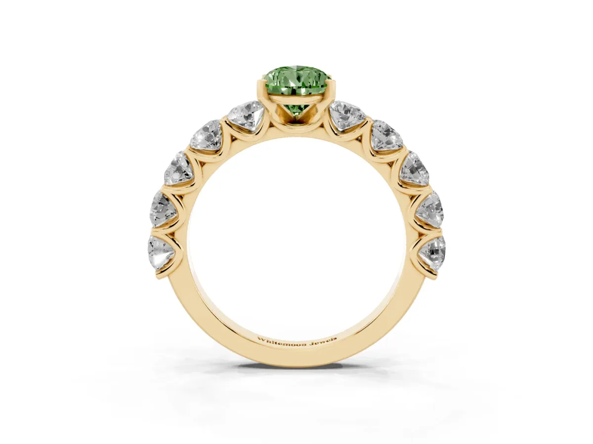 Fancy Green Pear Cut Diamond Prong Setting with Side Stones on a Pave Band Yellow gold