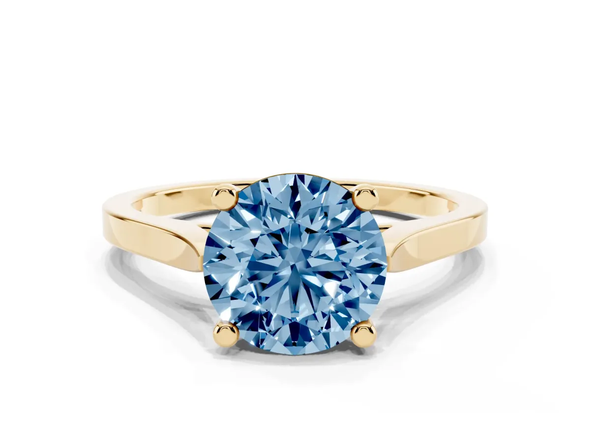 Fancy Blue Round Cut Solitaire Diamond Ring with Four-Prong Setting and Tapered Band Yellow gold