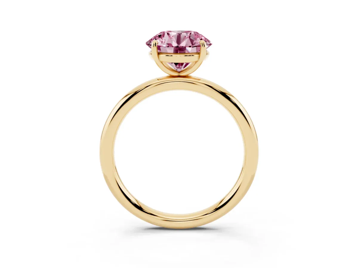 Fancy Pink Round Cut Solitaire Diamond Ring with Four-Prong Setting on a Plain Band Yellow gold