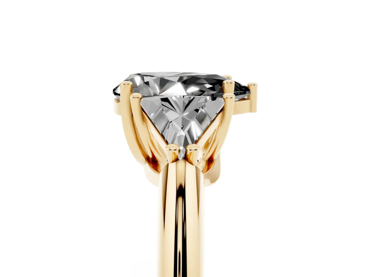 Fancy Black Three-Stone Pear Cut Diamond Engagement Ring with Trillion Side Stones and Prong Setting Yellow gold