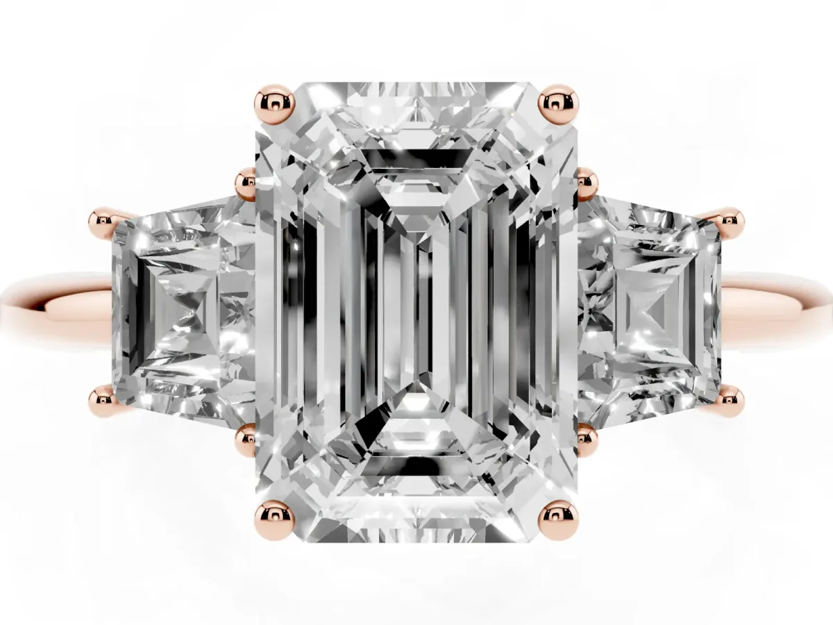 Emerald Cut Diamond Three-Stone Ring with Trapezoid Side Stones and Prong Setting Rose gold