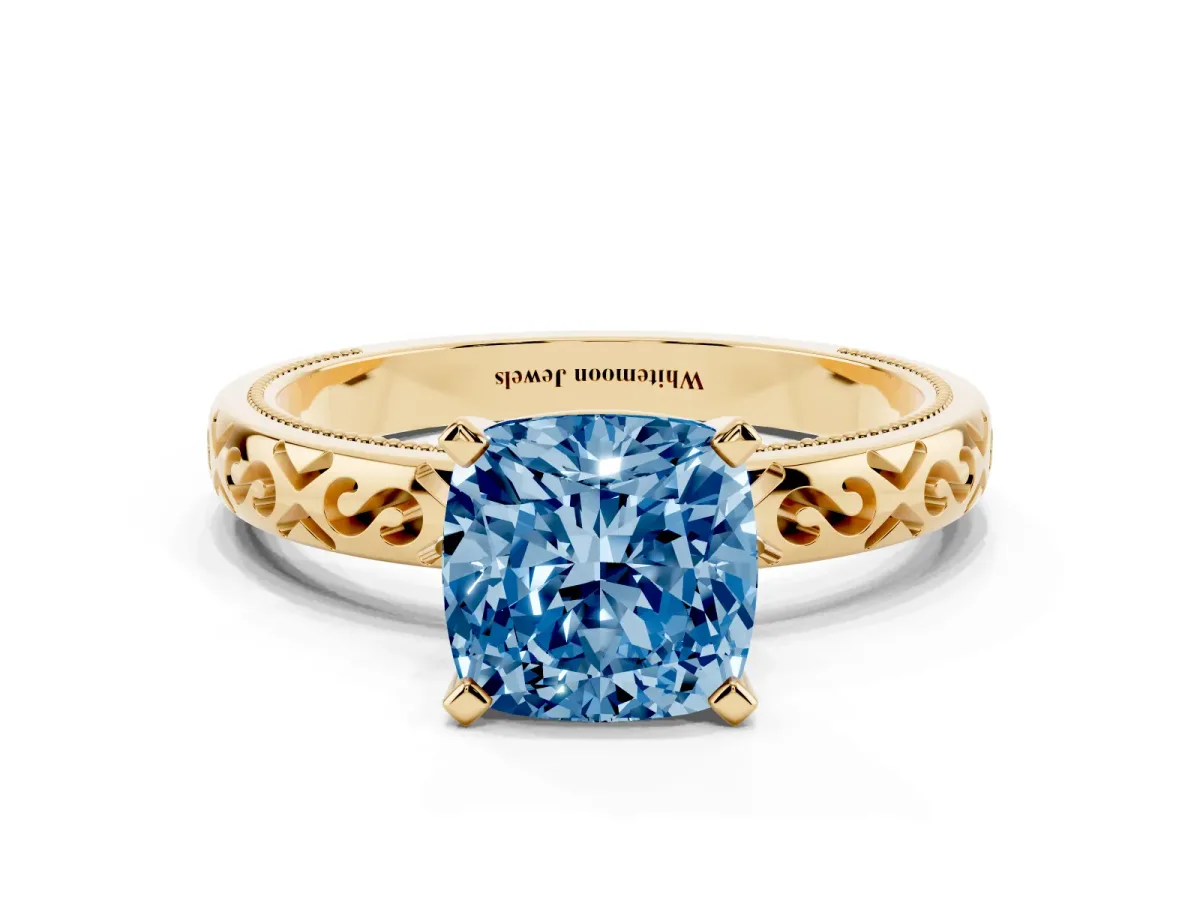 Fancy Blue Cushion Cut Solitaire Engagement Ring with Scrollwork Band and Four-Prong Setting Yellow gold