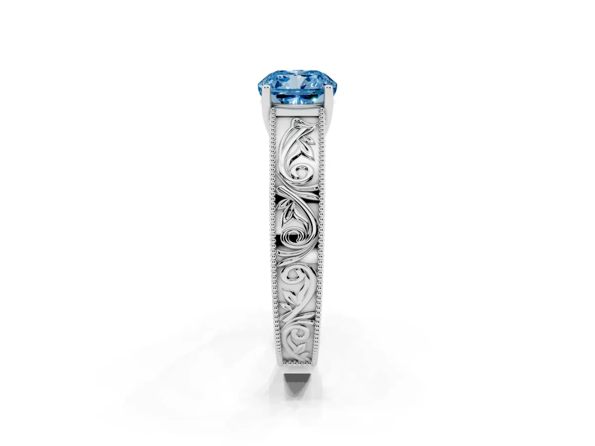 Fancy Blue Cushion Cut Diamond Solitaire Ring with Engraved Band and Four-Prong Setting Platinum