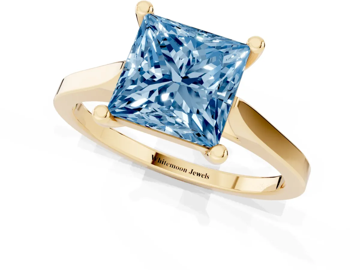 Fancy Blue Princess Cut Solitaire Diamond Ring with Four-Prong Setting and Tapered Band Yellow gold