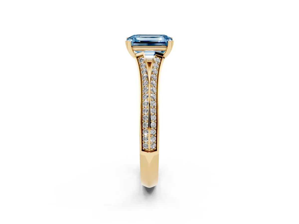 Fancy Blue Emerald Cut Diamond Split Shank Engagement Ring with Pavé Band Yellow gold
