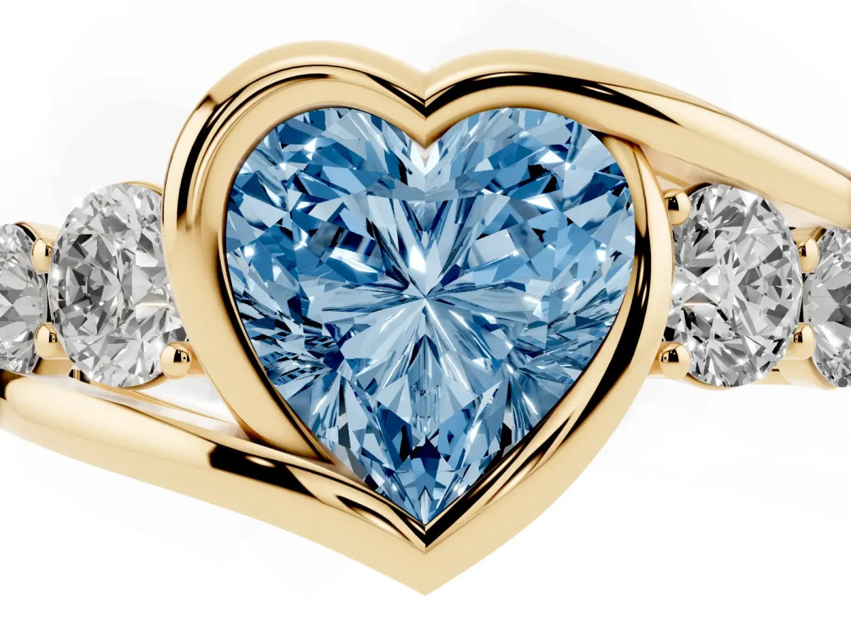 Fancy Blue Bezel Set Heart Cut Diamond Bypass Ring with Round Accents Yellow gold