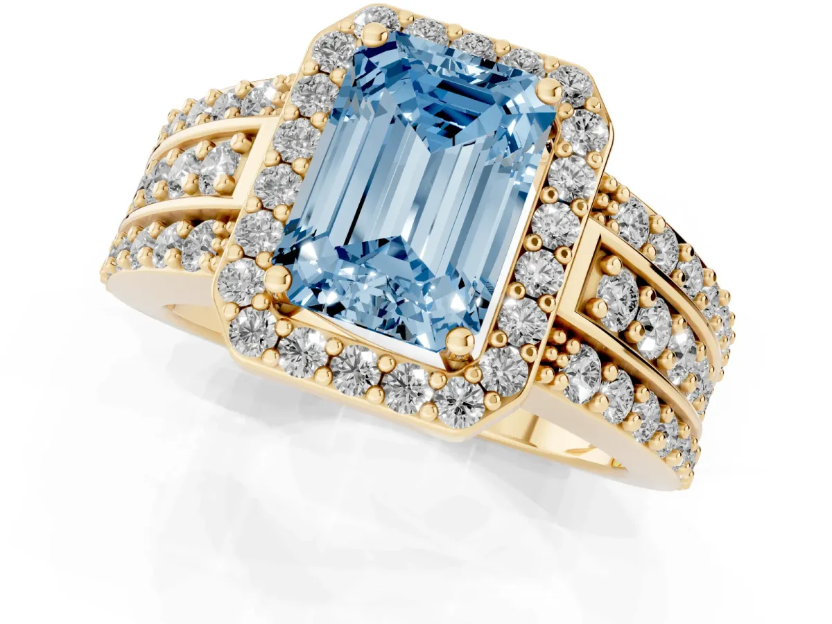Fancy Blue Emerald Cut Halo Diamond Ring with Round Split Shank and Prong Setting Yellow gold