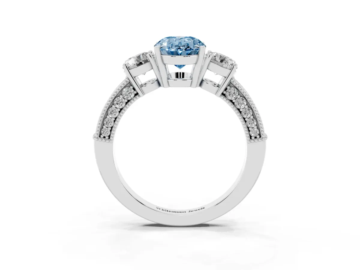 Fancy Blue Oval Cut Three-Stone Diamond Ring with Pavé Band and Four-Prong Setting Platinum