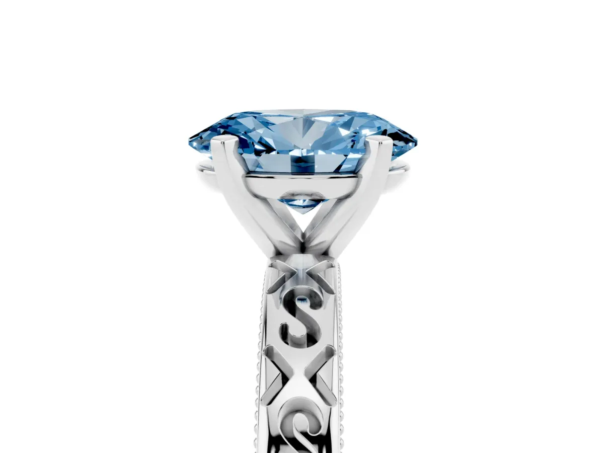Fancy Blue Oval Cut Solitaire Engagement Ring with Scrollwork Band and Four-Prong Setting Silver