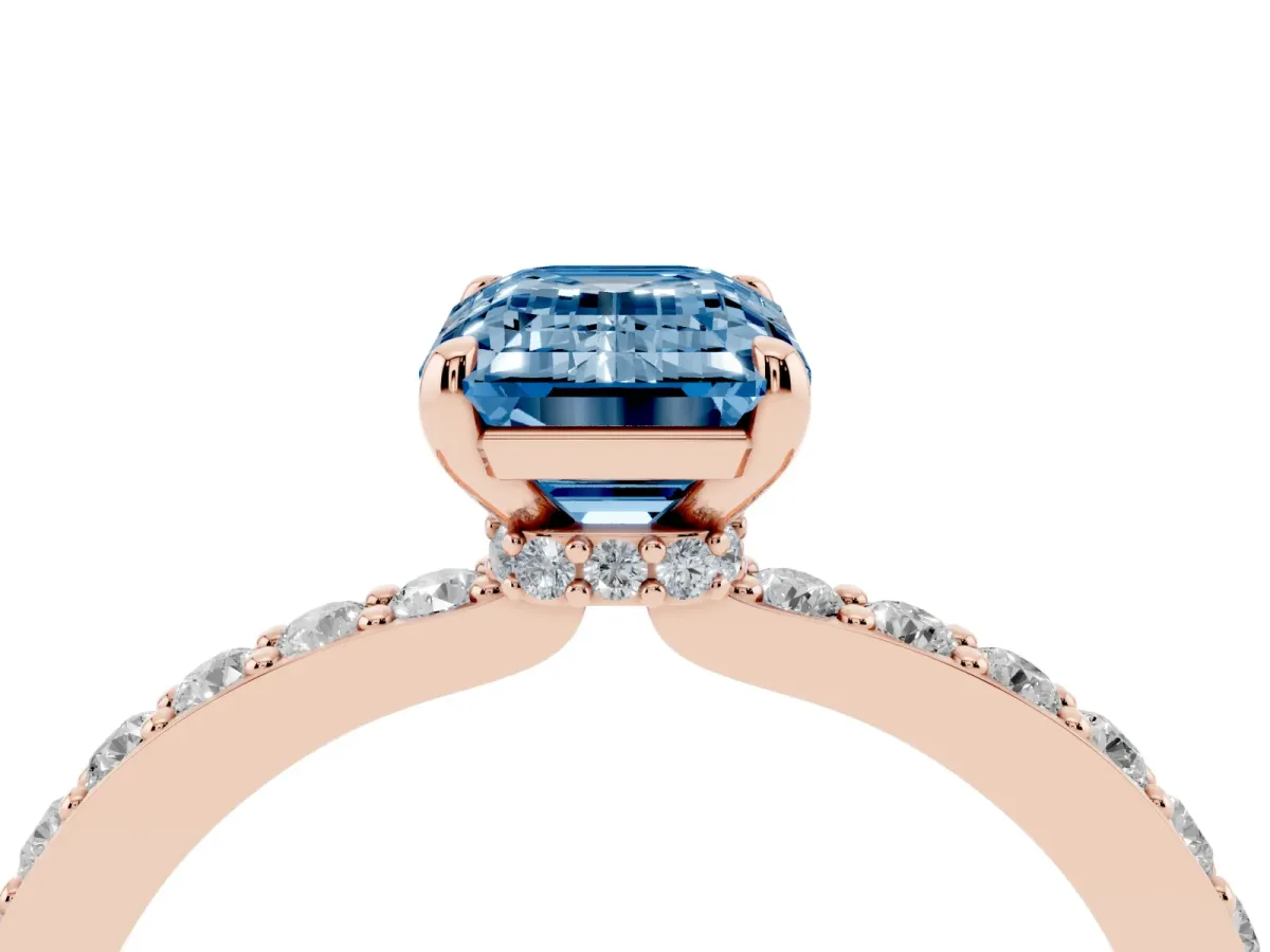 Fancy Blue Emerald Cut Diamond Solitaire Engagement Ring with Pavé Band and Four-Prong Setting Rose gold