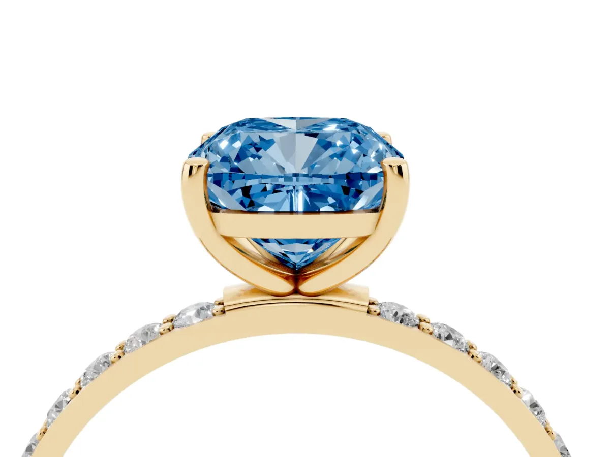 Fancy Blue Cushion Cut Diamond Solitaire Ring with Round Pavé Shoulders and Prong Setting Yellow gold