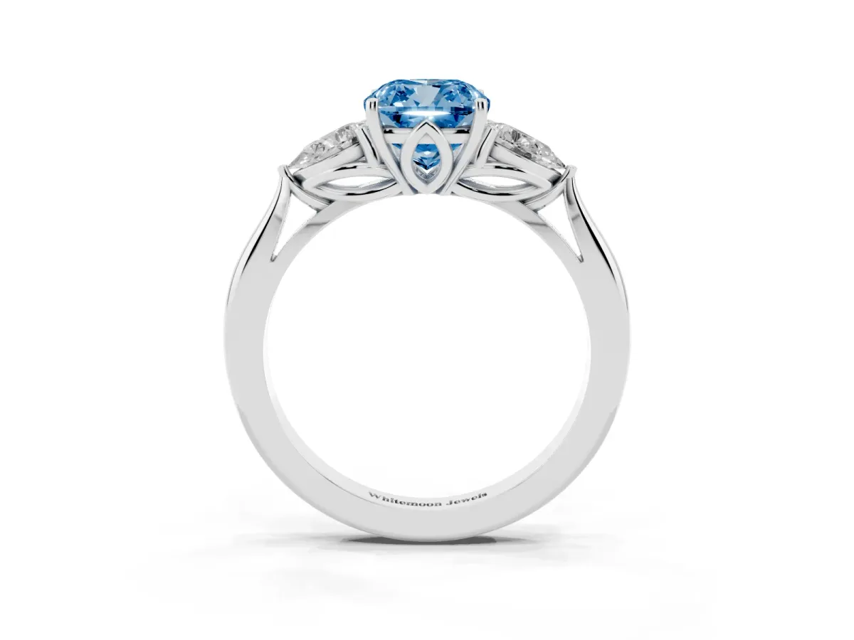 Fancy Blue Three-Stone Cushion Cut Diamond Ring with Pear Side Stones in Four-Prong Setting Silver