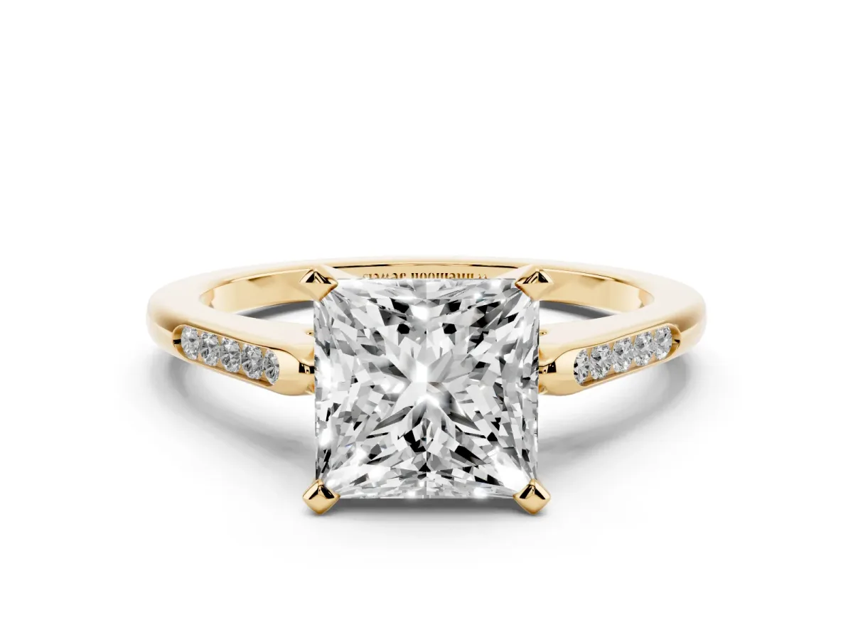 Princess Cut Diamond Solitaire Ring with Channel Set Round Band and Prong Setting Yellow gold