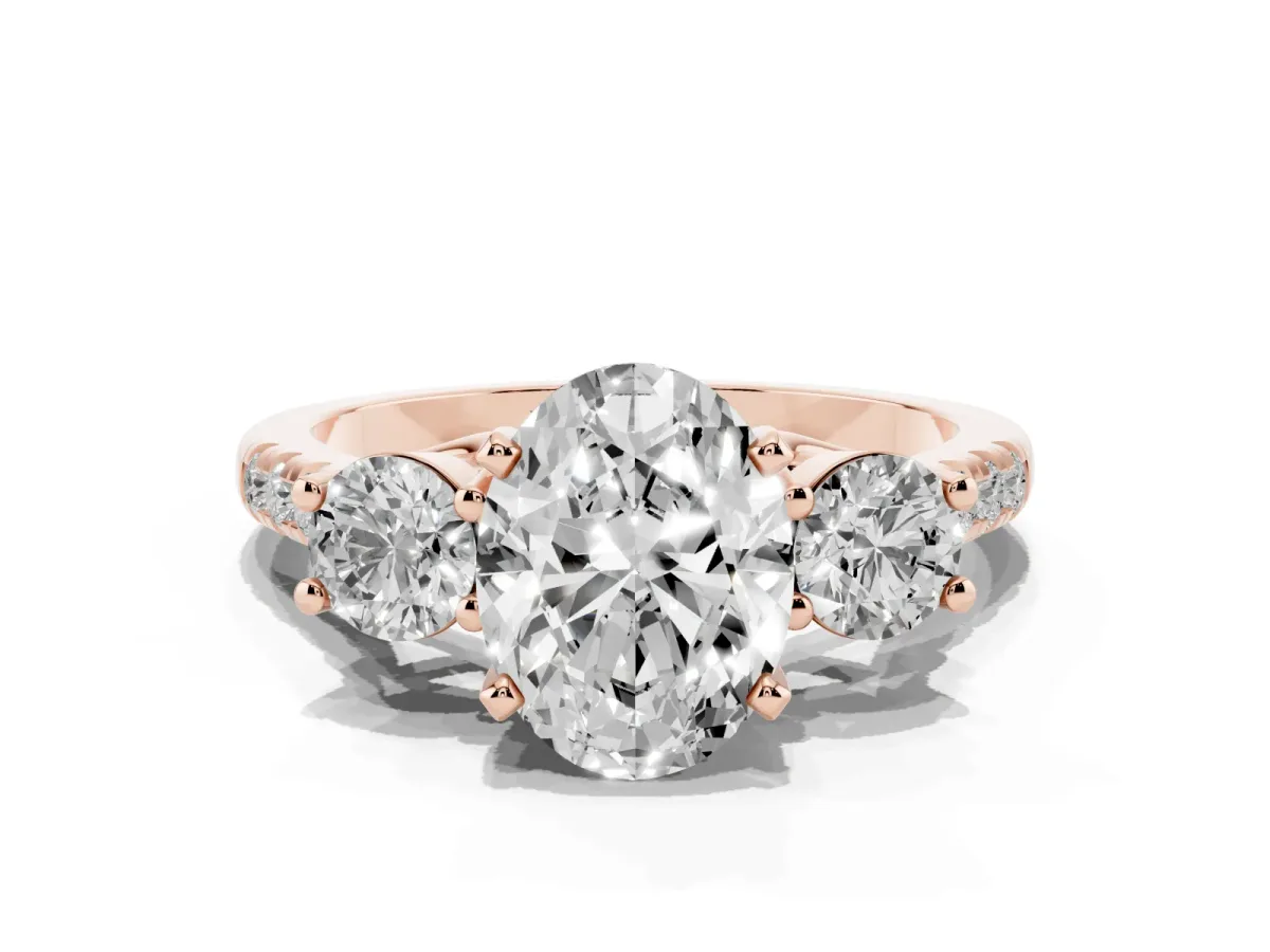 Three-Stone Oval Cut Diamond Pavé Band with Four-Prong Setting Rose gold