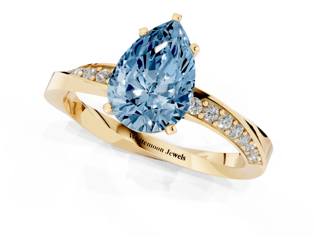 Fancy Blue Pear Cut Diamond Engagement Ring with Side Stone Accents and Four-Prong Setting Yellow gold