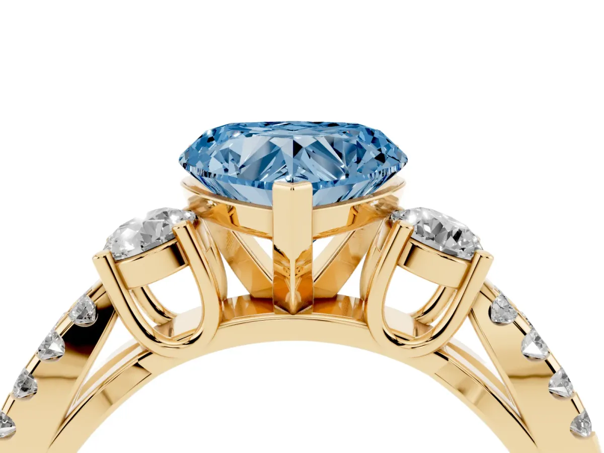 Fancy Blue Heart Cut Diamond Three-Stone Ring with Pavé Split Shank and Four-Prong Setting Yellow gold