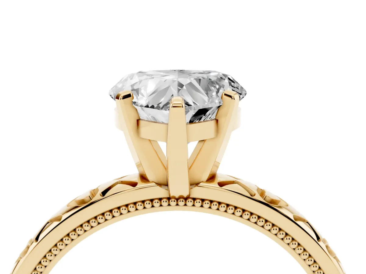 Heart Cut Solitaire Diamond Engagement Ring with XO Engraved Band and Four-Prong Setting Yellow gold