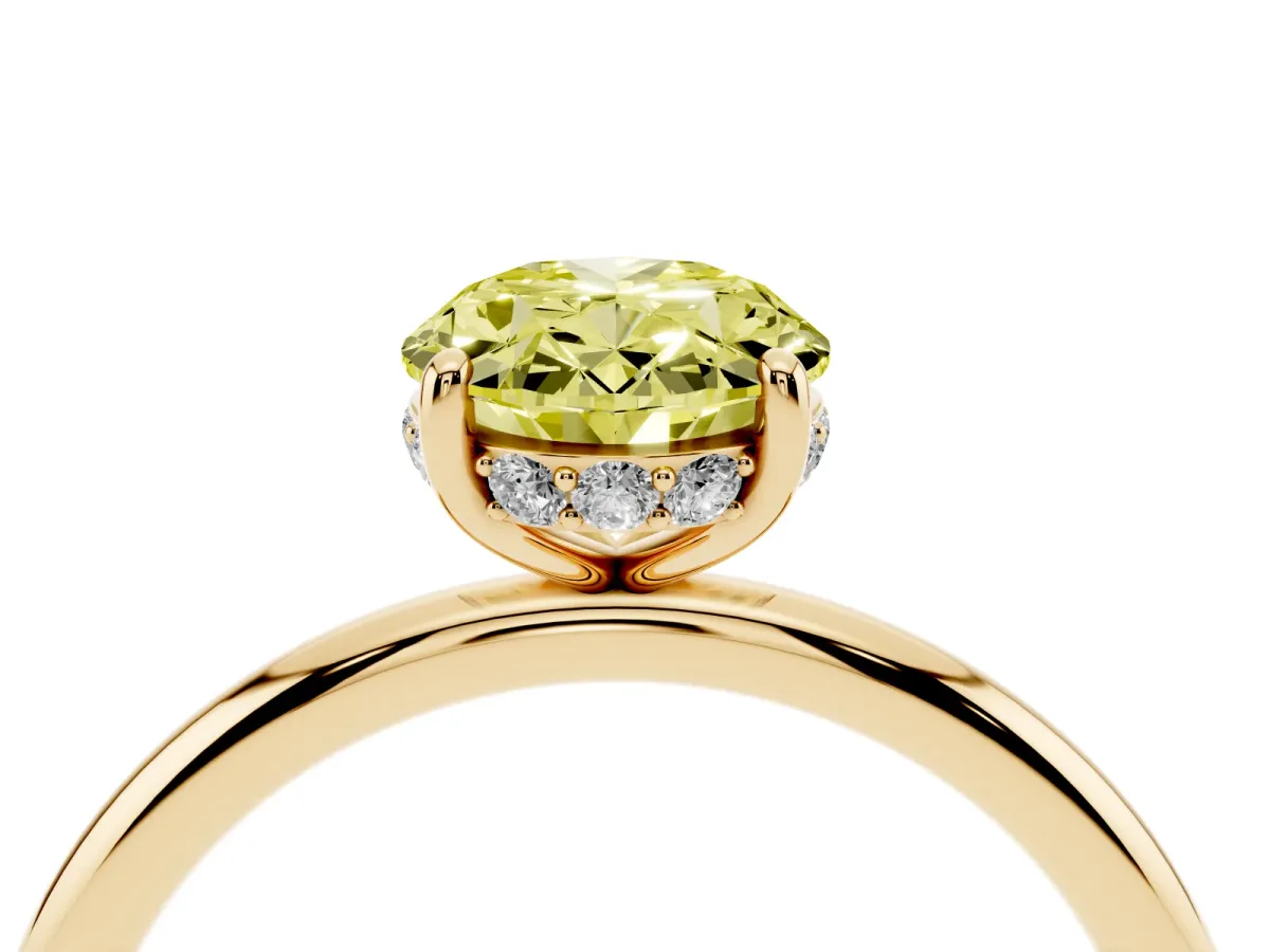 Fancy Yellow Oval Cut Solitaire Diamond Ring with a Classic Band and Four-Prong Setting Yellow gold