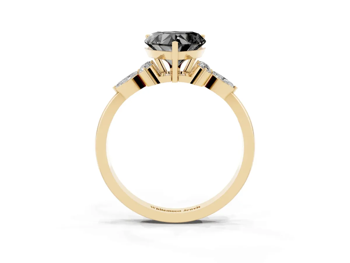 Fancy Black Heart Cut Brilliant Diamond Solitaire Ring with Pear Side Stones and Four-Prong Setting Yellow gold