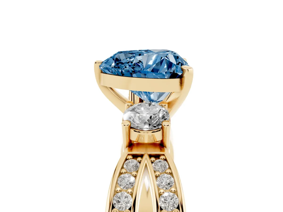 Fancy Blue Three-Stone Heart Cut Cut Diamond Twist Band with Prong Setting Yellow gold