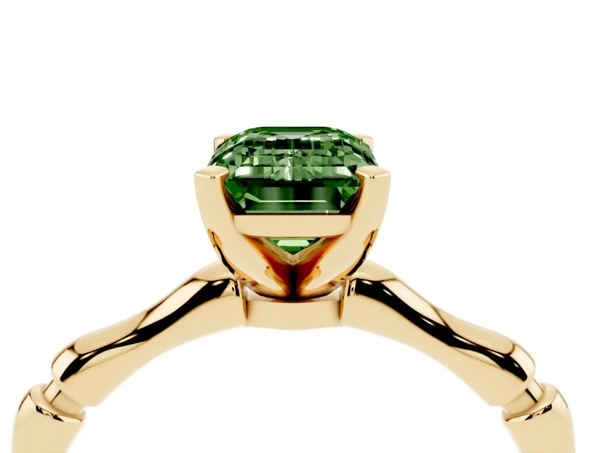 Fancy Green Emerald Cut Solitaire Diamond Ring with Bamboo Band and Four-Prong Setting Yellow gold