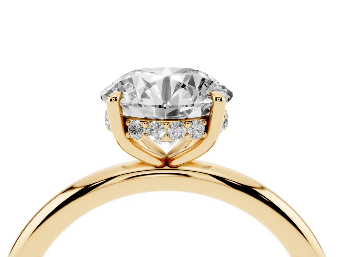 Round Cut Diamond Solitaire Ring with Thin Band and Four-Prong Setting Yellow gold