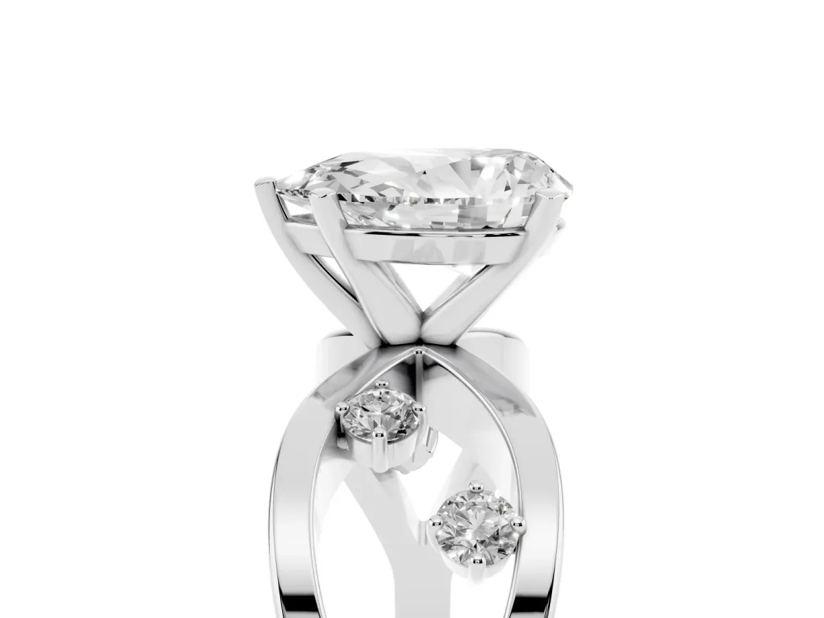 Pear Cut Cut Solitaire Diamond with Side Stones on Criss-Cross Band and Four-Prong Setting Silver