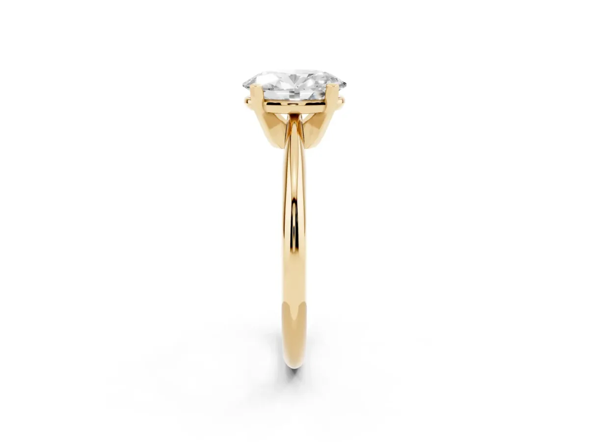 Oval Cut Cut Solitaire Ring with Four-Prong Setting on a Classic Band Yellow gold