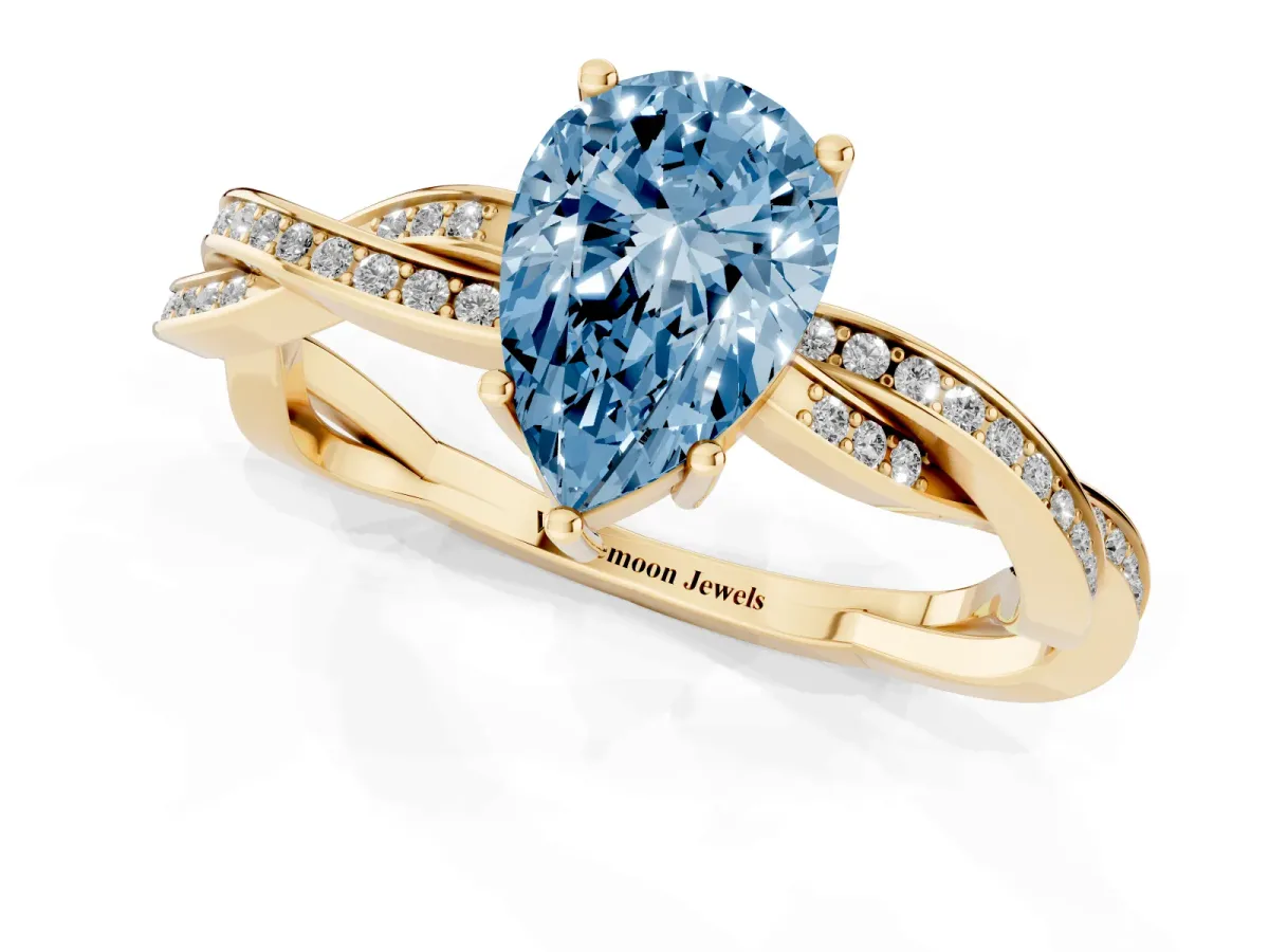 Fancy Blue Pear Cut Solitaire Twisted Pave Diamond Ring with Four-Prong Setting Yellow gold