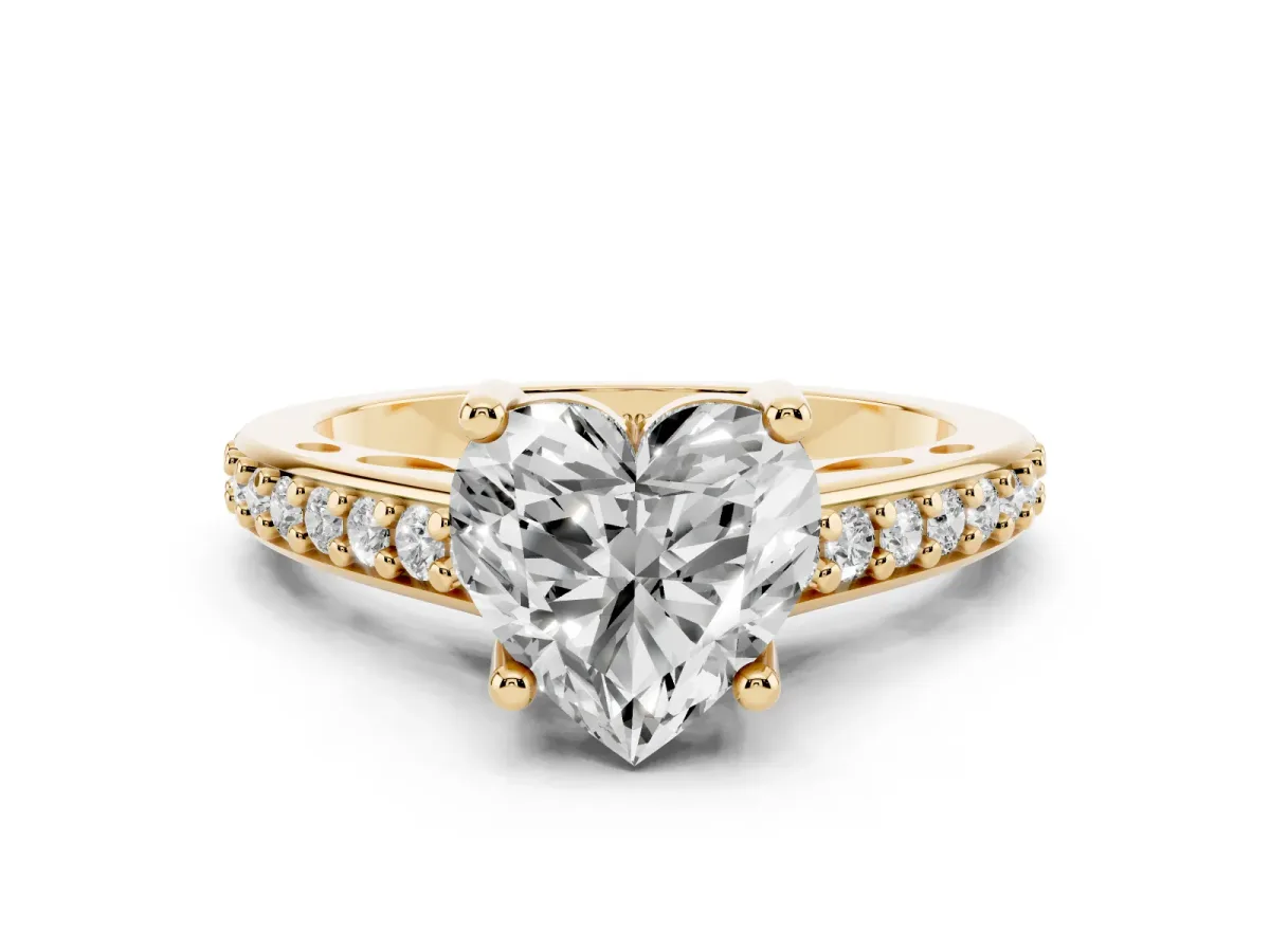 Heart Cut Solitaire Prong Set Diamond Engagement Ring with Pave Band Yellow gold