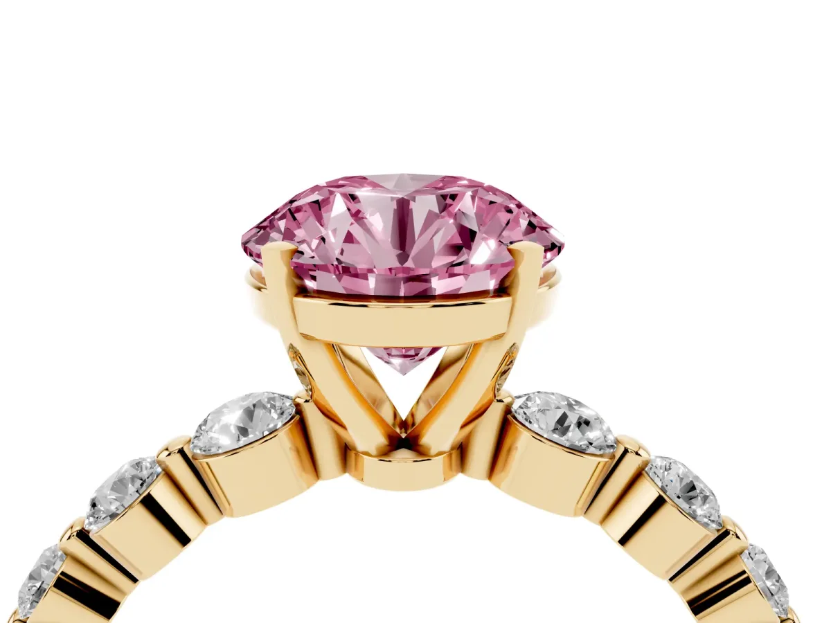 Fancy Pink Round Cut Solitaire Diamond Ring with Pave Band and Four-Prong Setting Yellow gold
