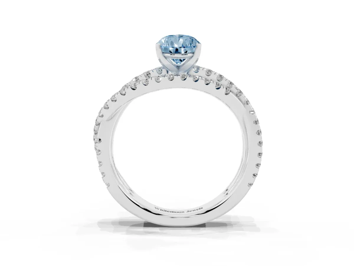 Fancy Blue Pear Cut Solitaire Twist Band with Pavé Setting and Four-Prong Setting Silver