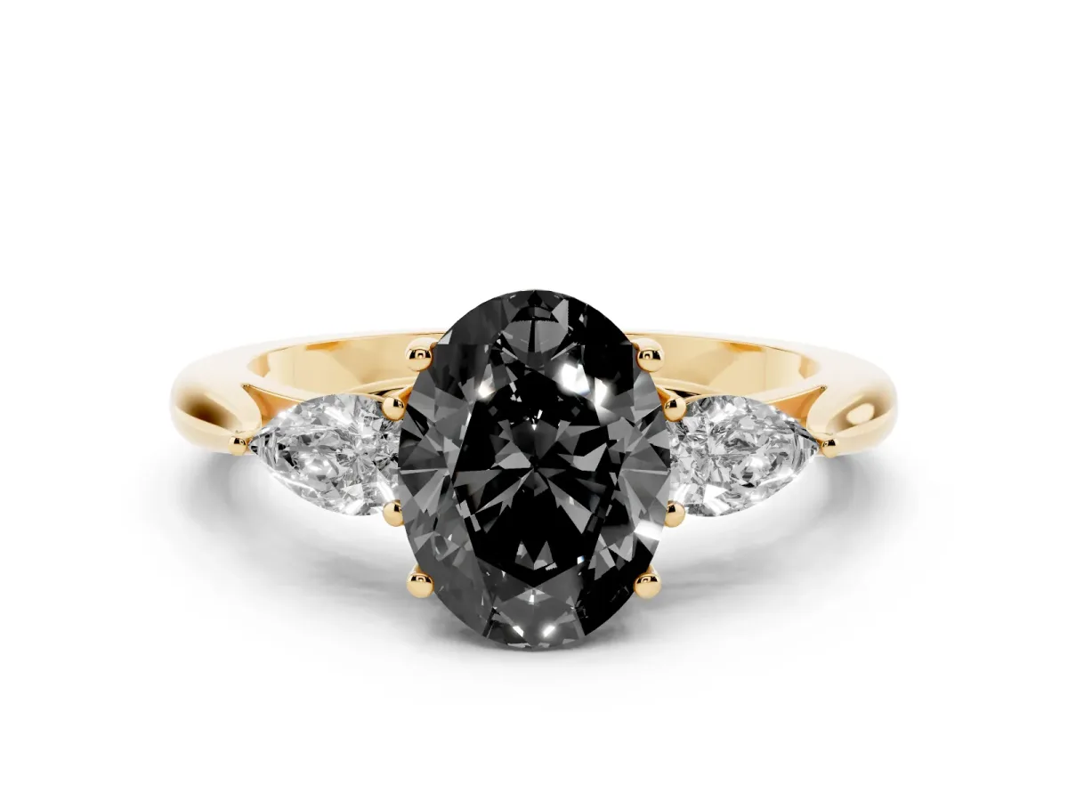 Fancy Black Oval Cut Diamond Three-Stone Ring with Pear Side Stones and Prong Setting Yellow gold