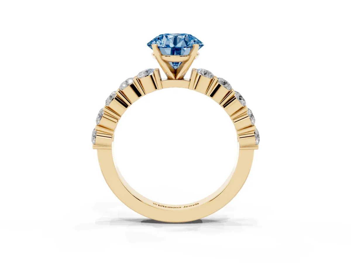 Fancy Blue Round Cut Diamond Solitaire Ring with Shared Prong Round Side Stones Yellow gold