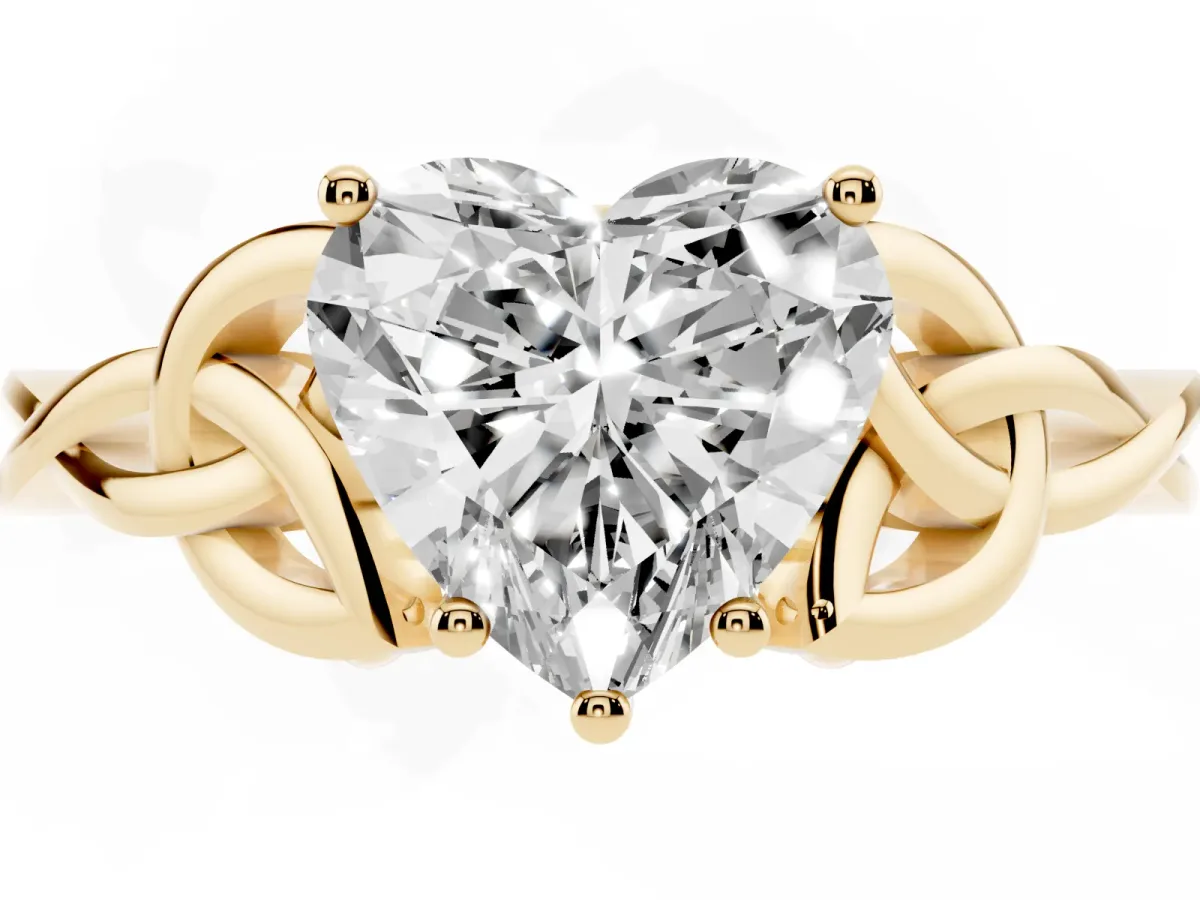 Heart Cut Diamond Solitaire Engagement Ring with Celtic Knot Band and Four-Prong Setting Yellow gold