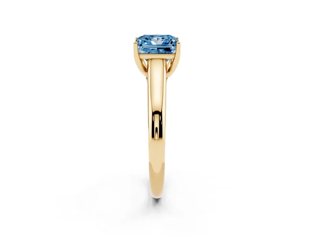 Fancy Blue Princess Cut Solitaire Engagement Ring with Tapered Band and Four-Prong Setting Yellow gold