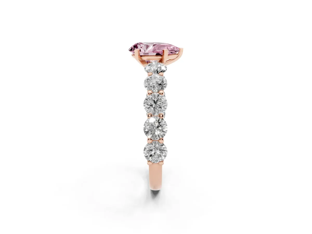 Fancy Pink Pear Cut Diamond Prong Setting with Side Stones on a Pave Band Rose gold