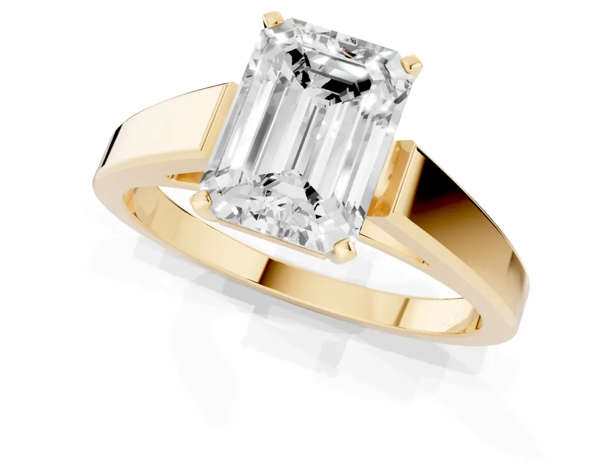 Emerald Cut Solitaire Engagement Ring with Four-Prong Setting and Tapered Band Yellow gold