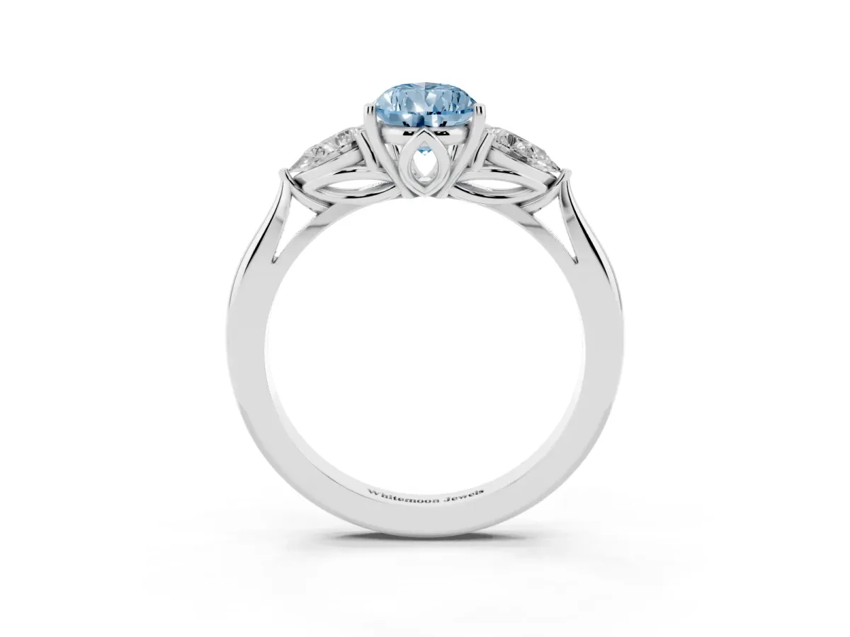 Fancy Blue Three-Stone Pear Cut Diamond Ring with Pear Side Stones in Four-Prong Setting Platinum