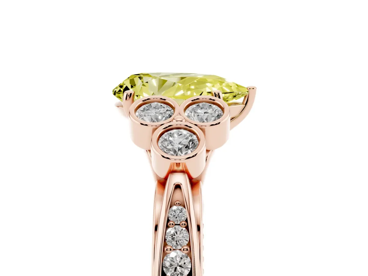 Fancy Yellow Pear Cut Cut Diamond Engagement Ring with Bezel Set Round Side Stones and Prong Setting Rose gold