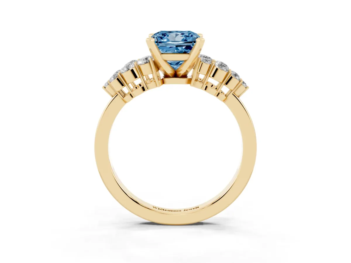 Fancy Blue Princess Cut Cluster Diamond Engagement Ring with Pavé Band and Four-Prong Setting Yellow gold