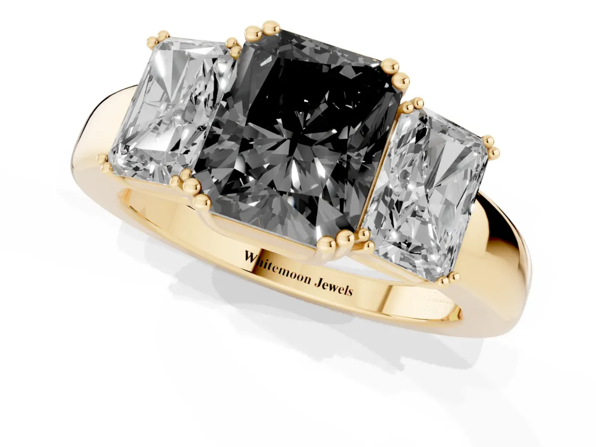 Fancy Black Three-Stone Radiant Cut Cut Diamond Ring with Channel Set Band and Four-Prong Setting Yellow gold