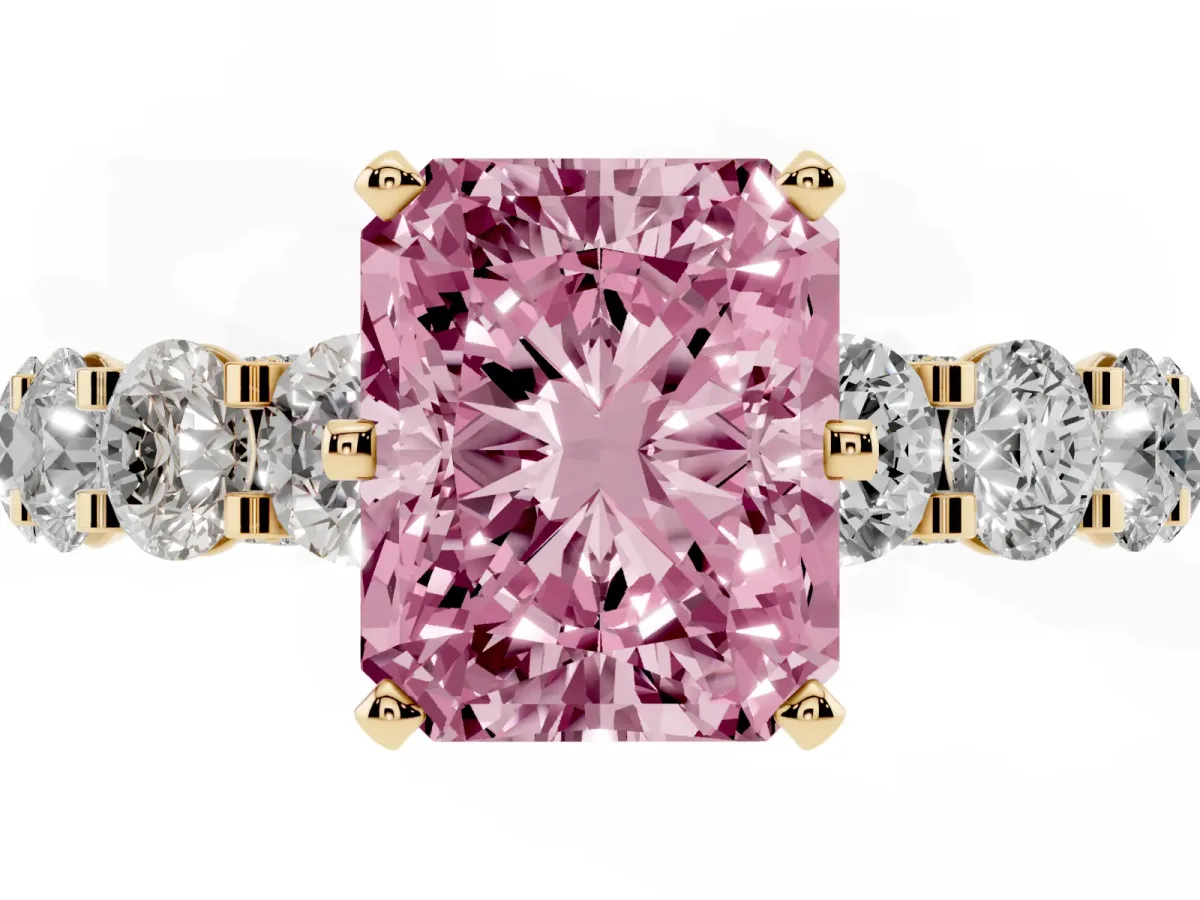 Fancy Pink Radiant Cut Diamond Side Stone Engagement Ring with Four-Prong Setting Yellow gold