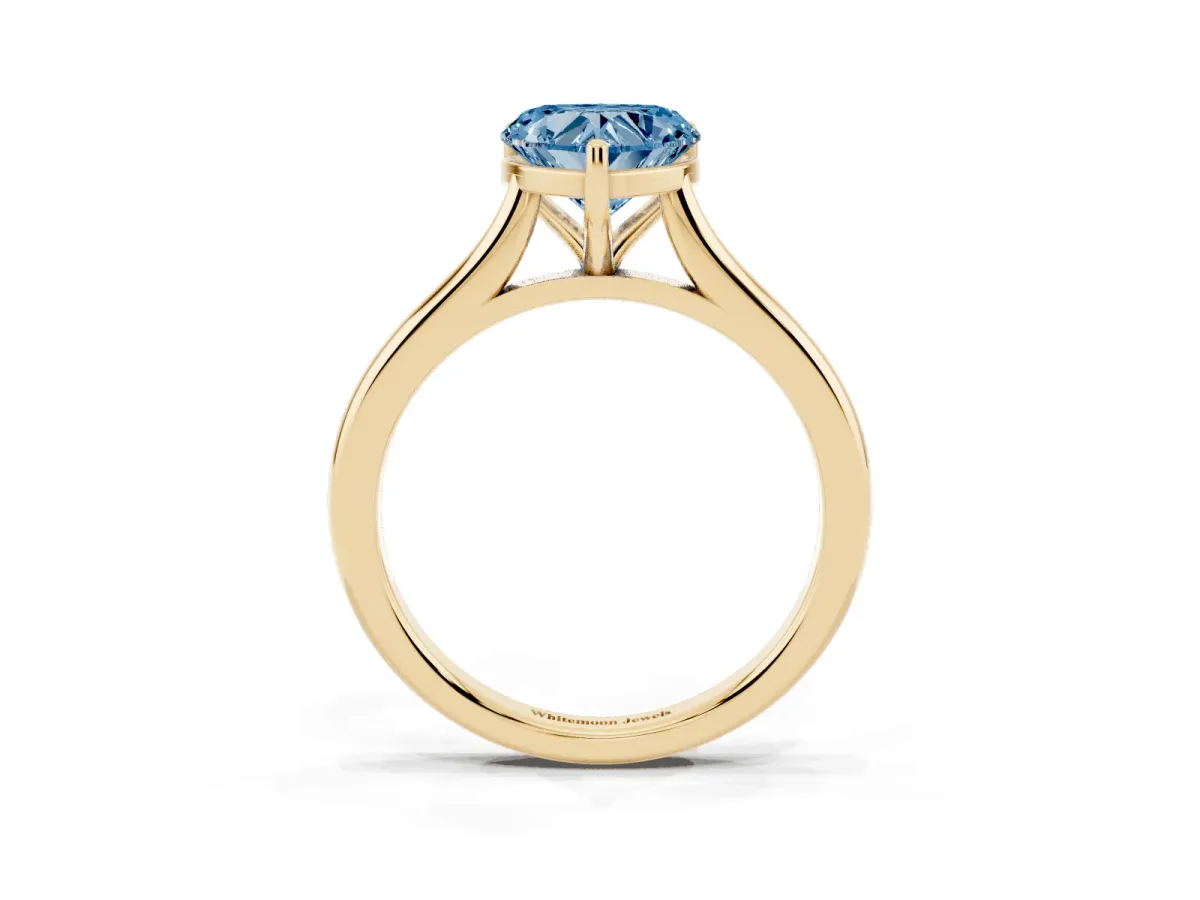 Fancy Blue Heart Cut Cut Solitaire Ring with Cathedral Band and Four-Prong Setting Yellow gold