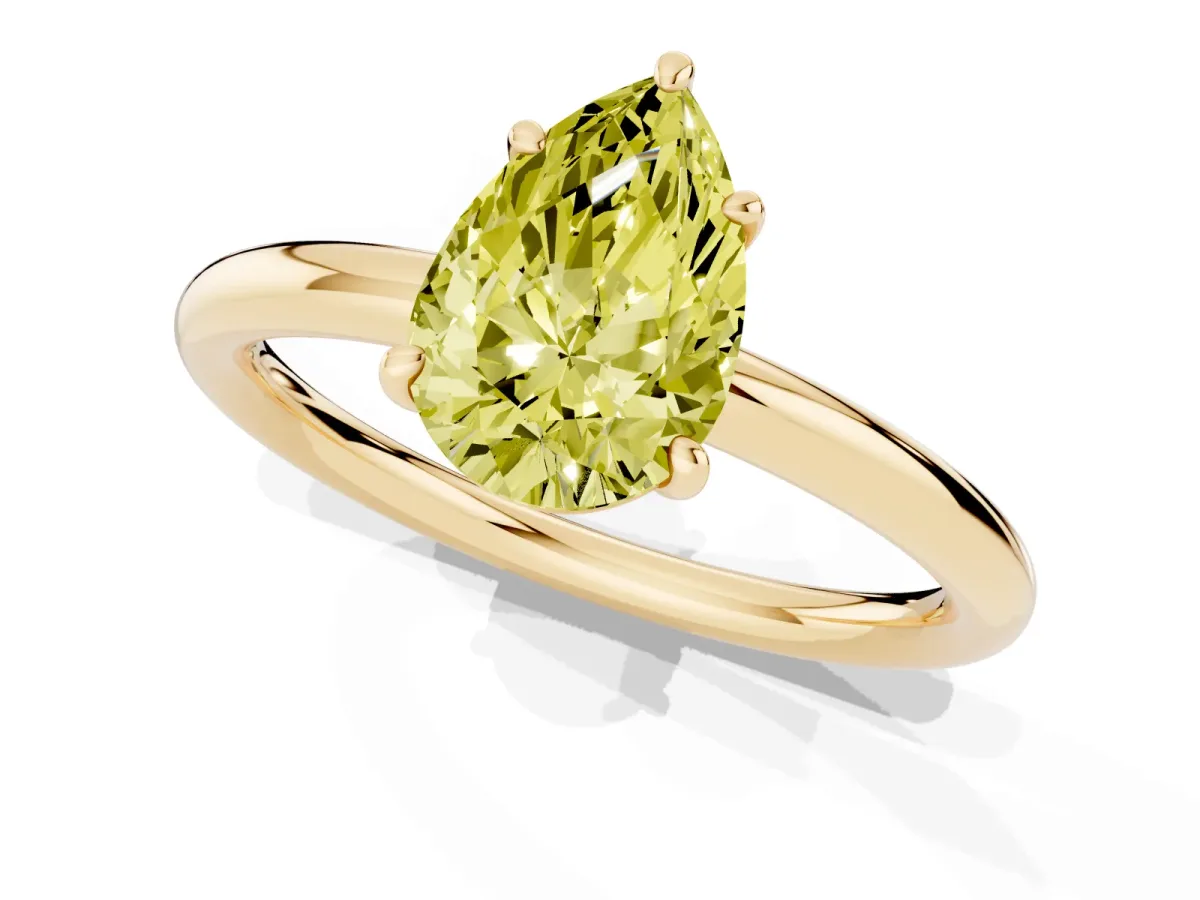 Fancy Yellow Pear Cut Solitaire Diamond Ring with Four-Prong Setting on a Plain Band Yellow gold