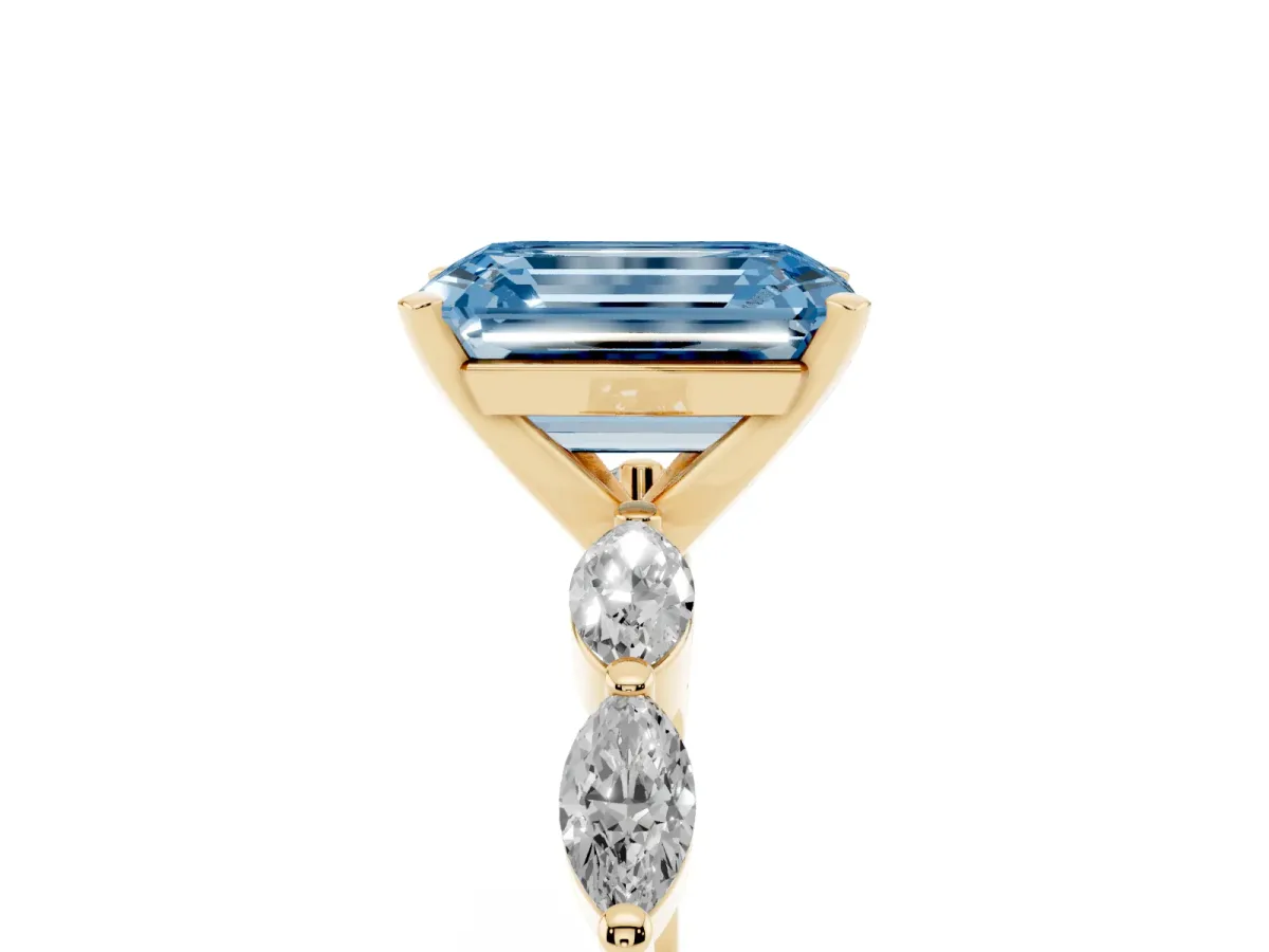 Fancy Blue Emerald Cut Diamond Ring with Marquise Side Stones and Prong Setting Yellow gold