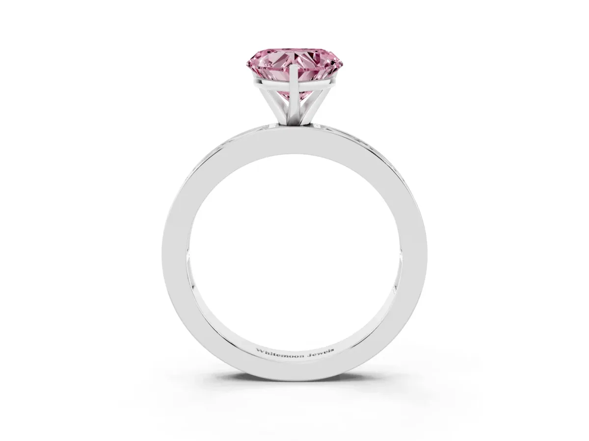 Fancy Pink Heart Cut Solitaire Diamond Ring with Channel-Set Baguette Band and Four-Prong Setting Platinum